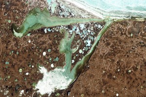 ncreased annual heat flux from Eurasian soils thaws permafrost and changes regional climate patterns. The Siberian landscape shone above is dotted with thermokarst lakes, those formed as permafrost melts. (Credit: NASA/ Jesse Allen and Robert Simmon).