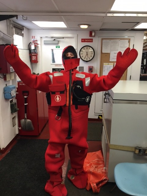 Trying on the "gumby" survival suit. 