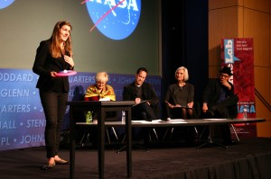 Julia DeMarines, of the Denver Museum of Nature & Science, uses a Frisbee as a model of the Milky Way to show where planets supporting life might be expected to form within a galaxy. Photo by Mary Catherine Adams, AGU.