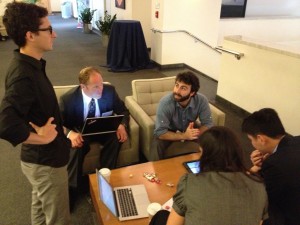 Scientists at last week’s workshop discuss how to explain Kepler’s laws using nothing but the 1,000 most common English words. Photo by Mary Catherine Adams