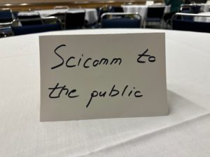 Sign that says Scicomm to the public