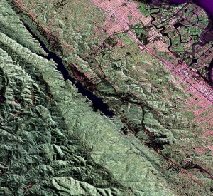 The dark black in the center of the image is a portion of the San Andreas Fault that runs west of the San Francisco Bay, near San Mateo. New research shows that two faults in the San Andreas system, the Hayward and Calaveras faults, are actually connected underground. Credit: NASA