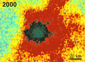 Data from NASA's QuikScat satellite show the changing extent of Beijing between 2000 and 2009 through changes to its infrastructure. Gray and black indicate buildings, with the tallest and largest buildings in the city's commercial core appearing lighter gray. Other colors show changes in areas not yet urbanized (for example, clearing land or cutting down trees), with the rate of change indicated by color. Blue-green indicates the least change, yellow-orange more change, and red the greatest change. Image credit: NASA/JPL-Caltech