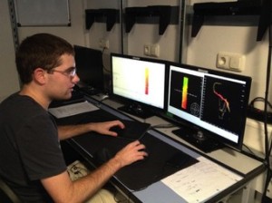 Ph.D. Student John Greene processes bathymetric data recently collected over survey line 8. Credit: SOI/Suraida Nanez-James 