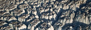 Deep cross-cutting crevasses form séracs near the terminus of Narsap Sermia, Greenland (64.68 °N, 49.75°W). The center séracs are approximately 40 meters wide. Credit: Horst Machguth
