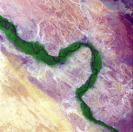 Life along the Nile, "Earth as Art," August 15, 2014. It is easy to see from this image why people have been drawn to the Nile River in Egypt for thousands of years. Green farmland marks a distinct boundary between the Nile floodplain and the surrounding harsh desert. Credit: USGS. 
