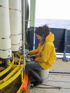 Alysha Coppola, who received her PhD from UCI in 2015 and is now a postdoctoral researcher of soil science and biogeochemistry at the University of Zurich, on the deck of the National Oceanographic and Atmospheric Administration research vessel Ronald Brown collecting seawater samples in search of black carbon in the North Atlantic Ocean. Samples were obtained from various depths down to 2,200 meters. Sample bottles were then frozen in the ship’s laboratory and transported back to UCI for further black carbon radiocarbon analysis. Credit: Samuel Billheimer