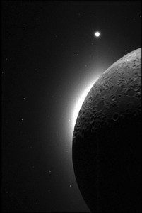 The slim, bright crescent, known as lunar horizon glow, was witnessed several times during Apollo missions. This picture was taken with the Clementine spacecraft, when the sun was behind the moon. The white area on the edge of the moon is the LHG, and the bright dot at the top is the planet Venus. Credit: NASA. 