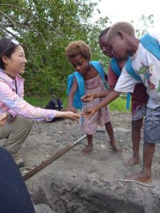 Showing school children sediment from a soil pit on Tanna at Port Resolution Bay. Credit: Isabel Hong.