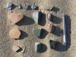 Photo 1: Ceramic shards from ancient pottery and stone fragments that prehistoric humans used to chip flakes from for cutting and hide-working tools. Credit: Adam Hudson. 