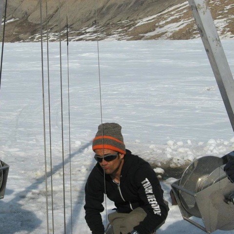 François Lapointe collects sediment cores from South Sawtooth Lake on Ellesmere Island, Nunavut, Canada in 2015. Credit: François Lapointe. 