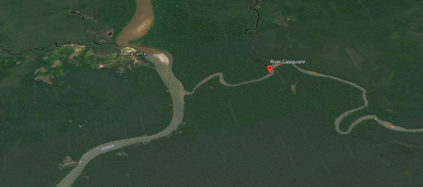 Although it looks like a tributary, the Rio Casiquiare is a rare distributary of the upper Rio Orinoco (left), flowing south to meet the Rio Negro about 340 kilometers (200 miles) to the right of the image in the Amazon River Basin. The Casiquiare is about 90 meters wide where it splits from the Orinoco, diverting about a quarter of the Orinoco’s water. Eventually the Casiquiare will conduct the all of the flow from the 40,000-square-kilometer (25,000-square-mile) drainage basin away from the upper Orinoco and into the Amazon, according to new research.