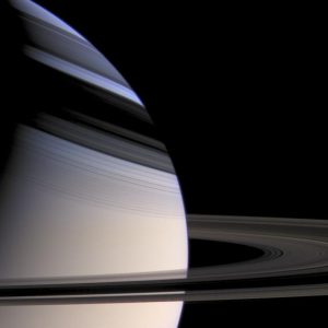 Saturn’s rings shade the winter hemisphere, keeping sunlight from making the hazes that give most of the planet its golden color. The clearer atmosphere is blue thanks to the same light scattering phenomenon at work in Earth’s skies. Credit: NASA/JPL/Space Science Institute