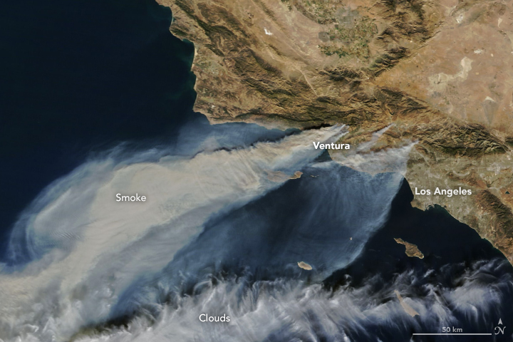 Santa Ana winds blew smoke from the fast-moving Thomas, Creek and Rye fires over the Pacific on 5 December 2017. Wind gusts topped 112 kilometers (70 miles) per hour that week. An extended span of dry weather left the ground parched well into Southern California’s “wet” season, which starts in October. Credit: NASA Earth Observatory