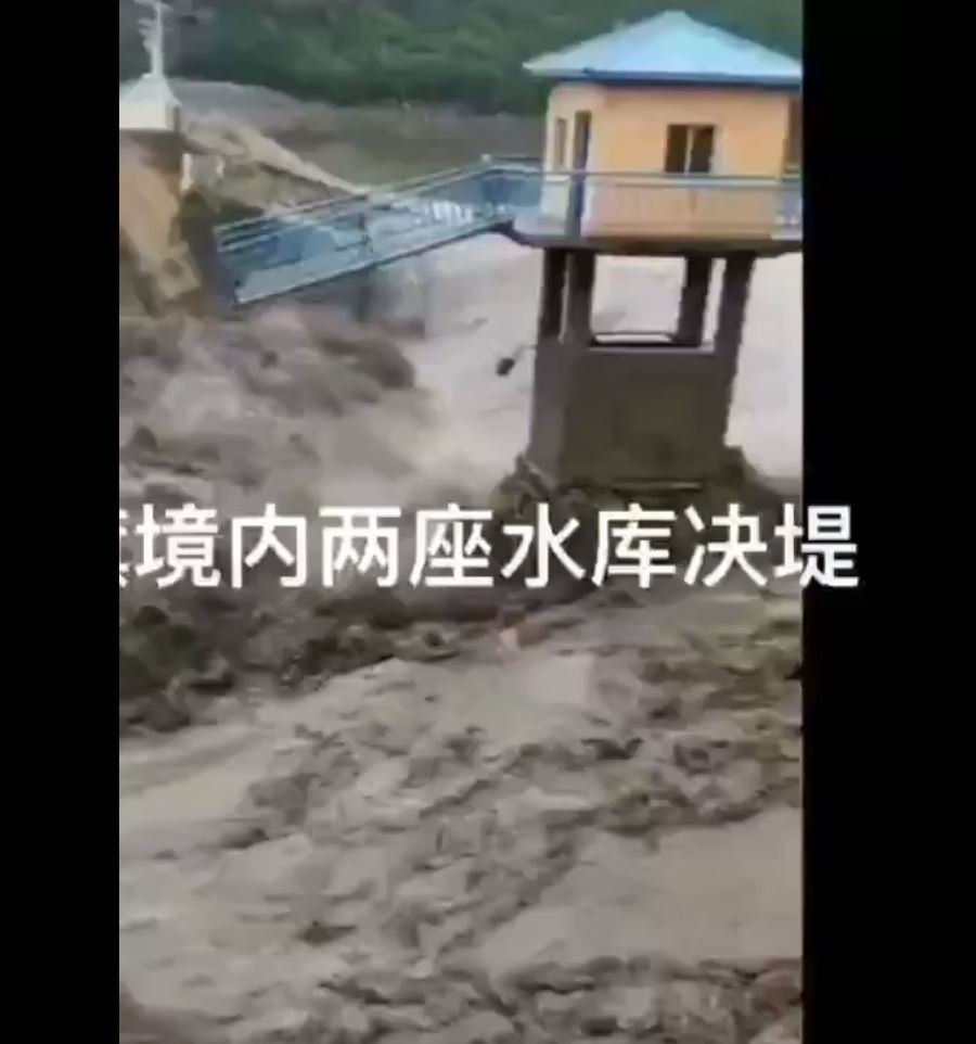 A still from a video posted to Twitter showing the collapse of the Yong'an dam in Hulunbuir, China on 18 July 2021.