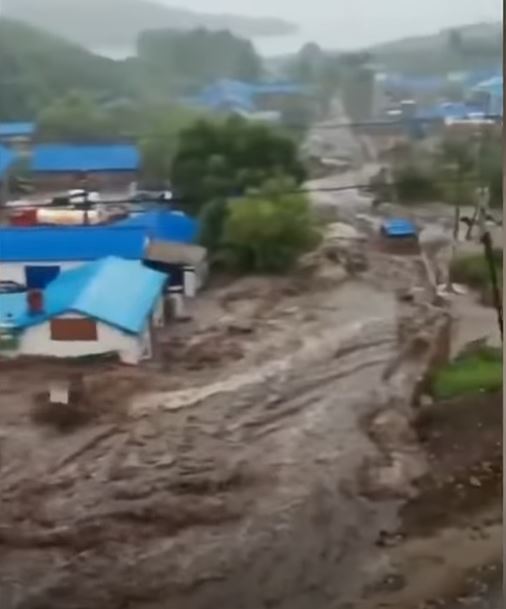 Flooding from the dam collapses in Hulunbuir in
                China on 18 July 2021