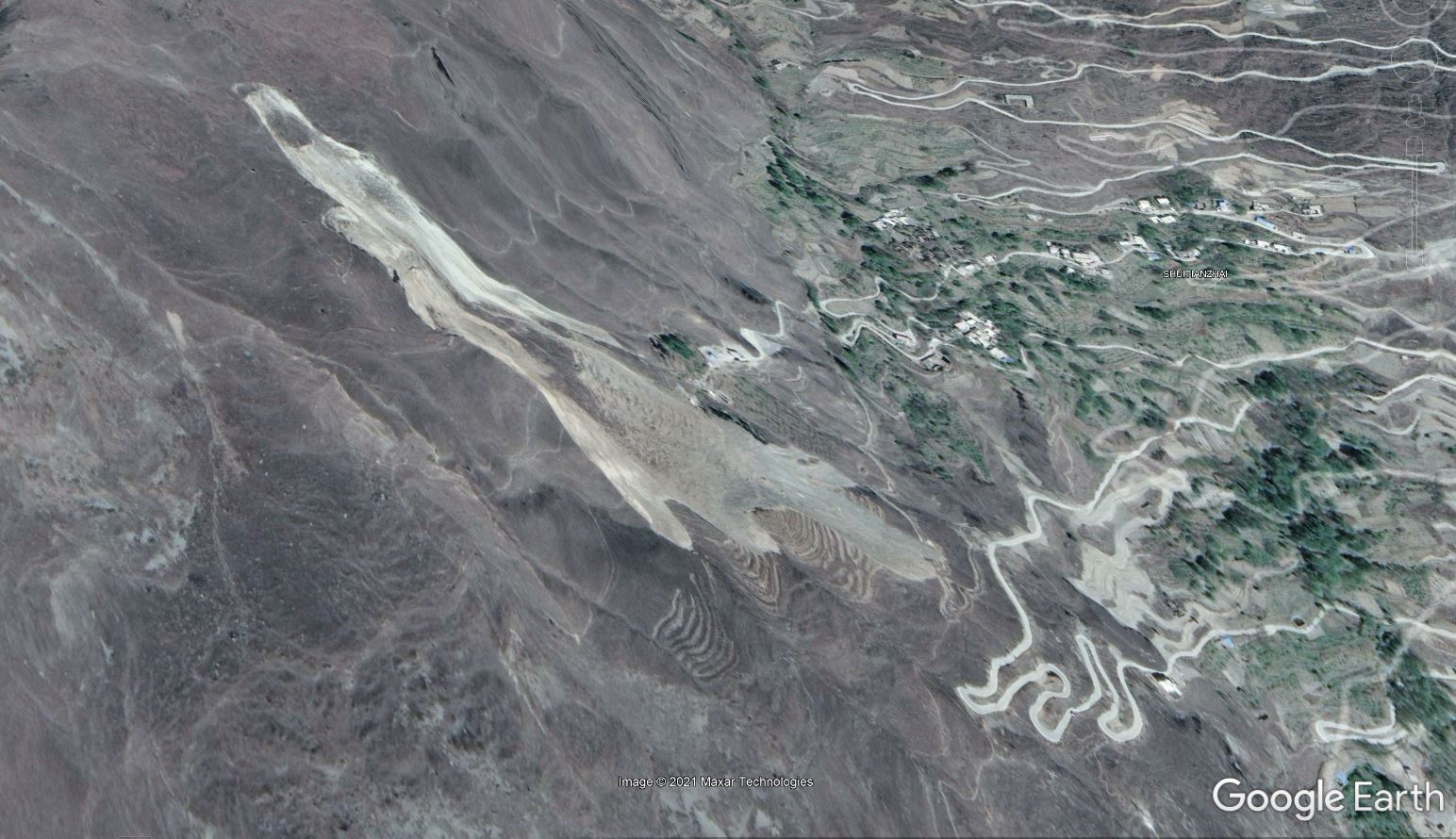 Google earth image showing the 8 August 2017 Tonghua landslide in Sichuan Province, China.