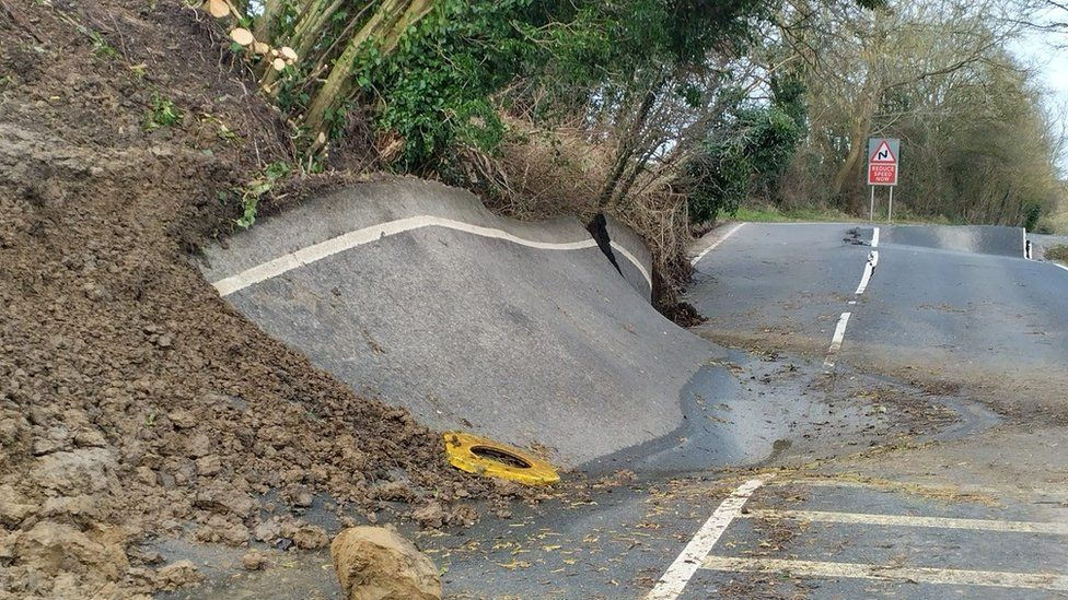 Damage to the B4069 in Lyneham, Wiltshire. Image from the BBC.