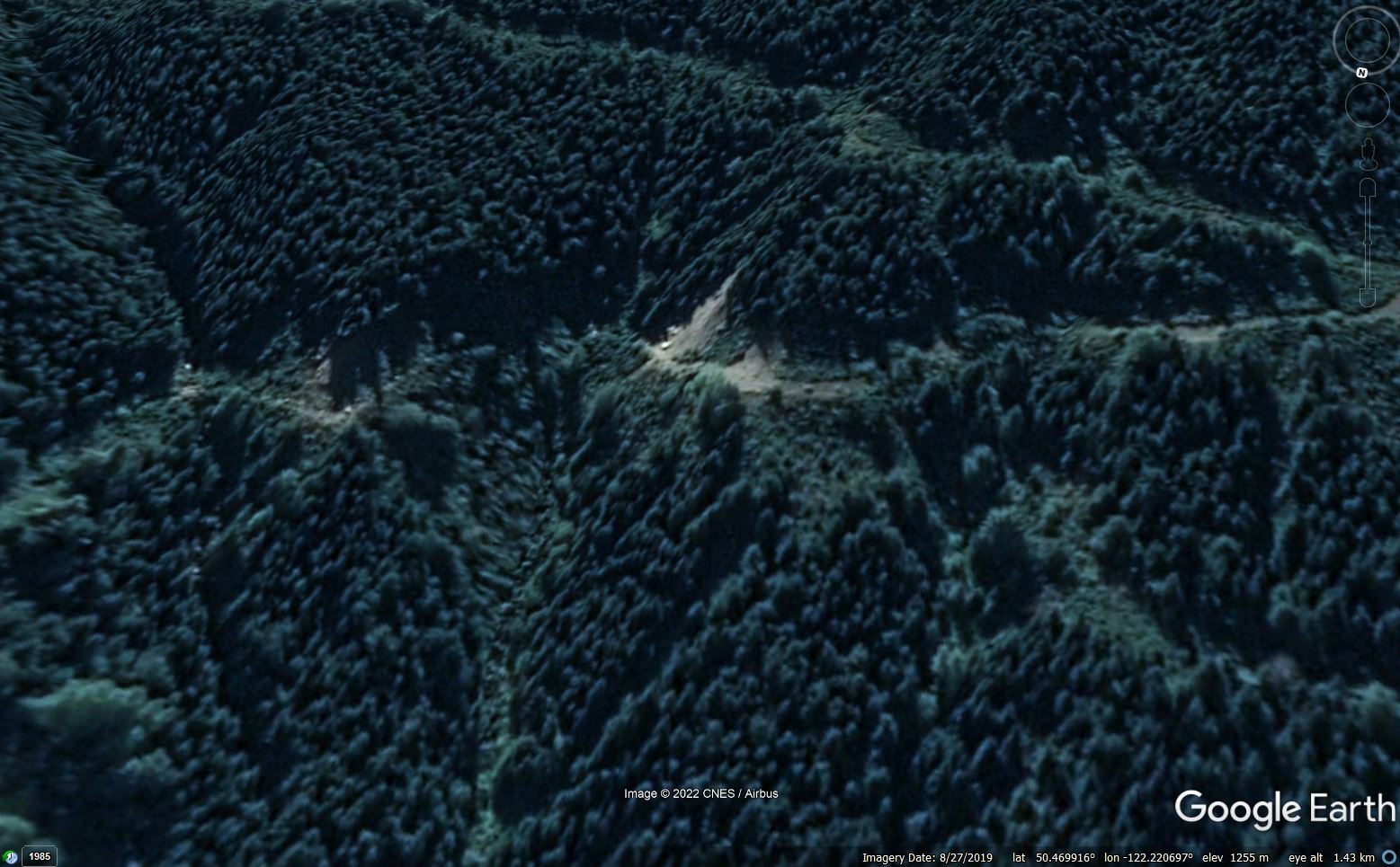 Google Earth image show small landslides on the resource road close to the source of the Duffey Lake landslide.