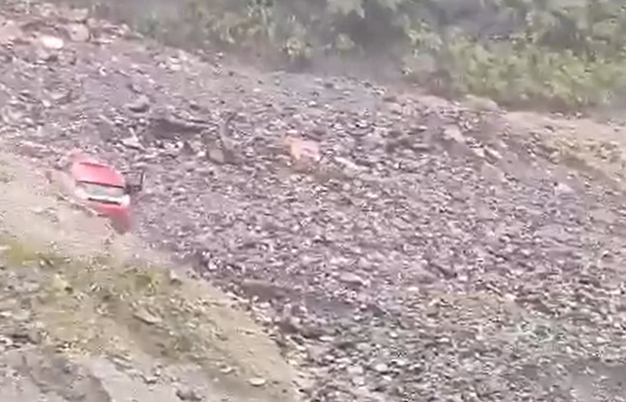 The driver starts to escape from the 28 July 2023 debris flow at Ribi Korong in Arunachal Pradesh in northern India.