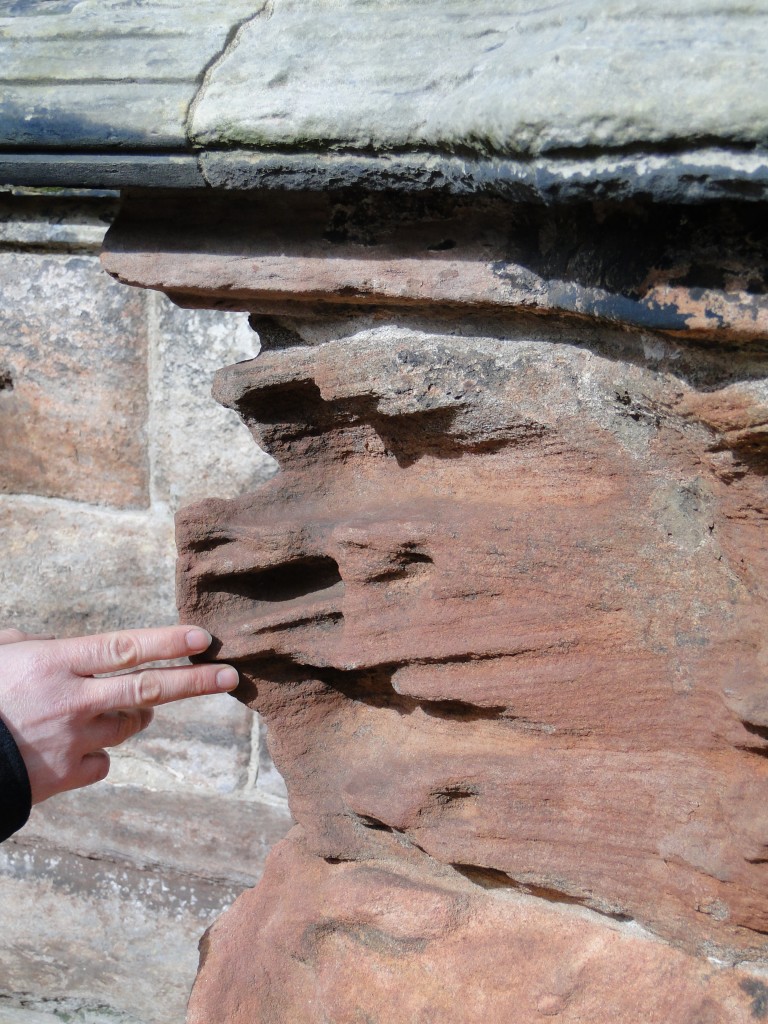 Severe weathering on a cornerstone, exposing the leeward slope of the crossbeds