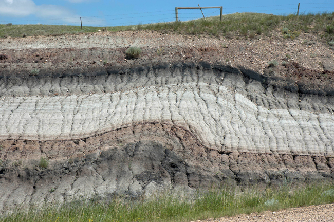 Glacial drag fold in bedrock, road cut, Hwy 573, east of Willow Creek Hoodoos, SE of Rosedale, Alberta
