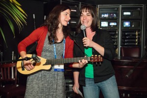 Bronwen Konecky backed up Lily Cohen, a former undergraduate mentee, on a song about Arctic fieldwork during Open Mic Night at the 2013 AGU Fall Meeting. Photo credit: AGU.