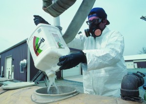 A Maryland farmer loads Roundup (glyphosate) herbicide into sprayer tank (NRCS Photo)