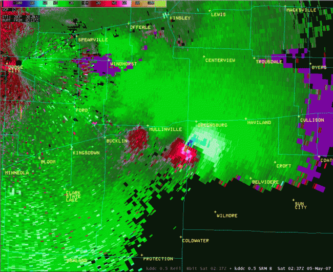Doppler Radar image of winds showing the Greensburg Kansas EF5 tornado. The blue colour near Greensburg is strong wind blowing toward the radar. The Pink is very strong wind going away from the radar. The tornado wiped out the town of Greensburg.