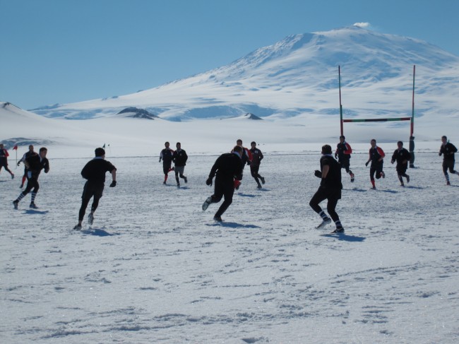 Mount Erebus in the background. The match was played on frozen McMurdo Sound. A very warm 0C..