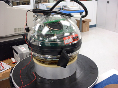 A Digital Optical Module. Designed to detect blue light from Neutrinos hitting atoms in the clear dark ice beneath the Pole.