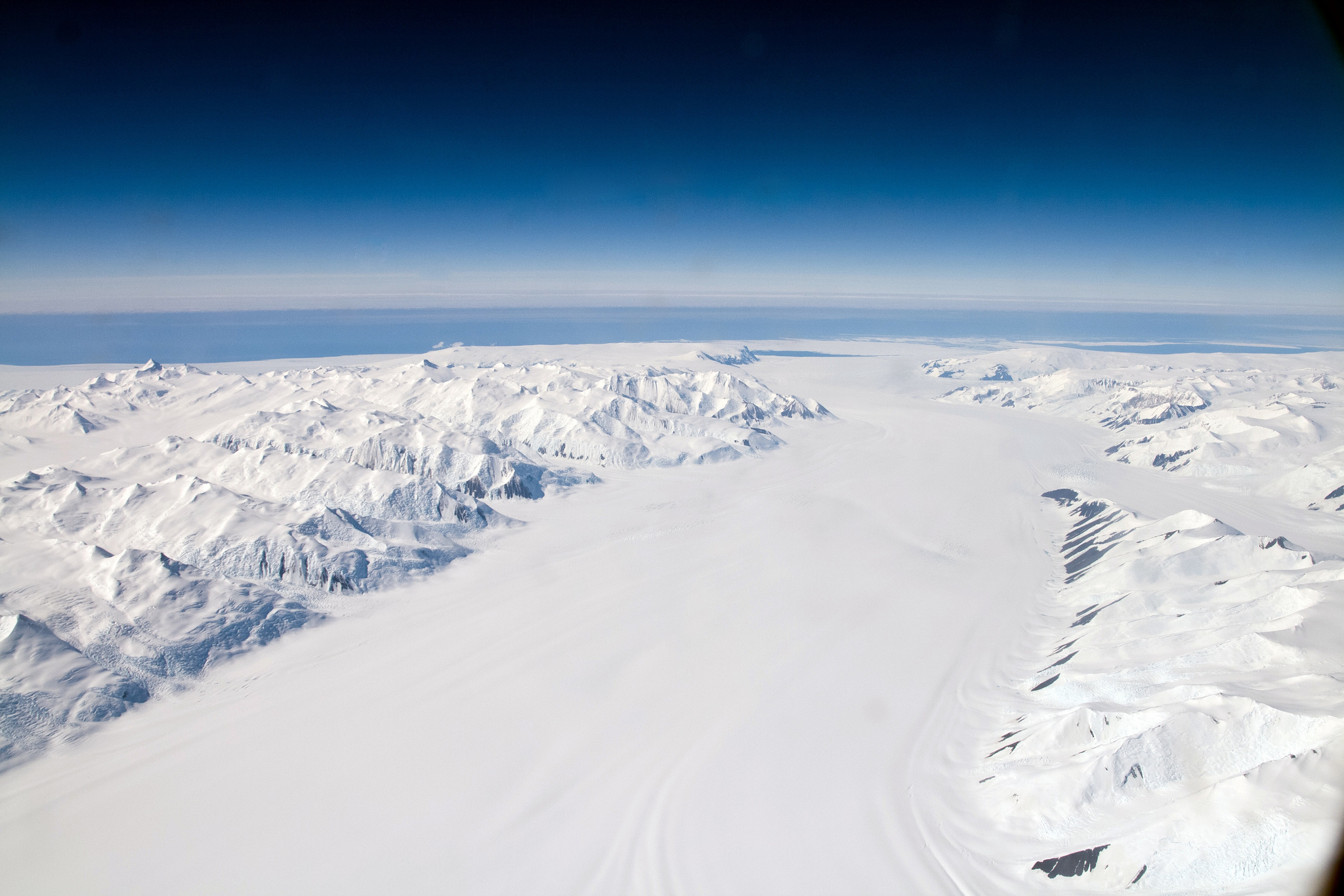 How Antarctica's rivers of ice will behave in a warming world has been the subject of much research and and answers are now being found. Dan's photo from high above Antarctica.